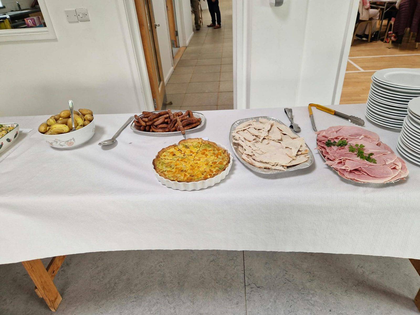 Quiche, cold meats and new potatoes
